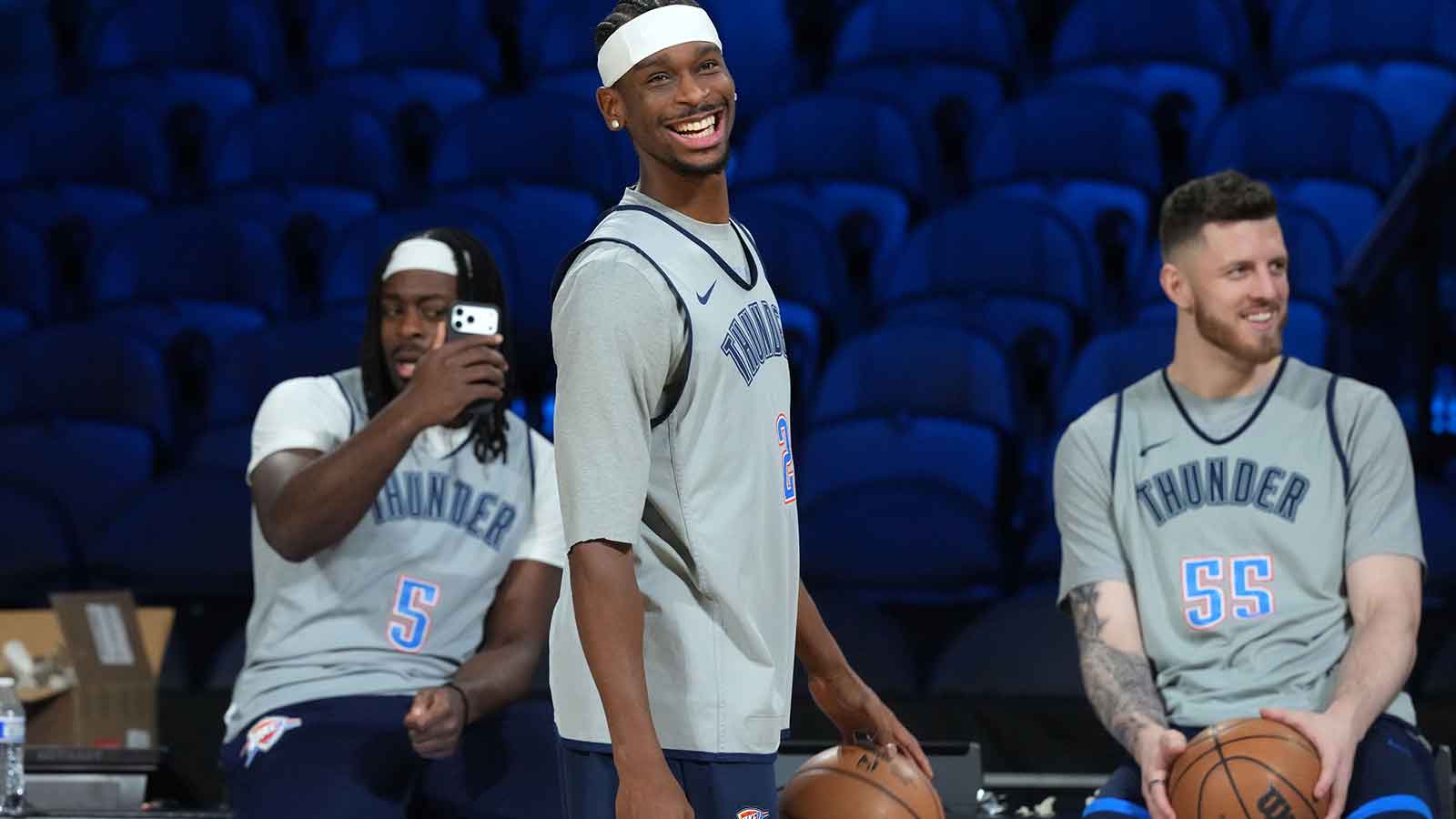 Thunder guard Luguentz Dort (5), guard Shai Gilgeous-Alexander (2) and center Isaiah Hartenstein (55) react during practice prior to the Emirates Cup semifinals at T-Mobile Arena