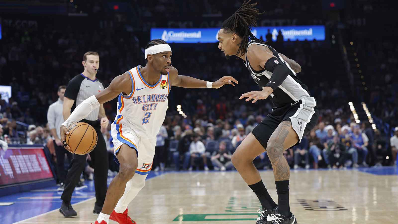 Thunder guard Shai Gilgeous-Alexander (2) drives around San Antonio Spurs guard Stephon Castle (5) during the second half at Paycom Center
