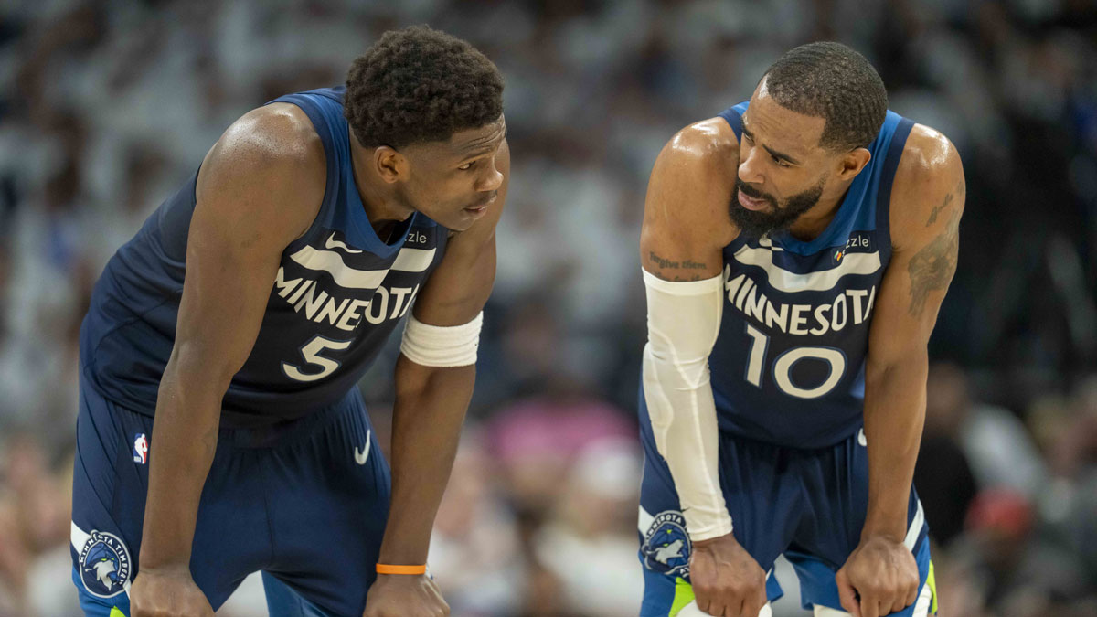 May 14, 2025; Minneapolis, Minnesota, USA; Minnesota Timberwolves guard Anthony Edwards (5) looks on with Minnesota Timberwolves guard Mike Conley (10) against the Golden State Warriors in the first half during game five of the second round for the 2025 NBA Playoffs at Target Center. Mandatory Credit: Jesse Johnson-Imagn Images