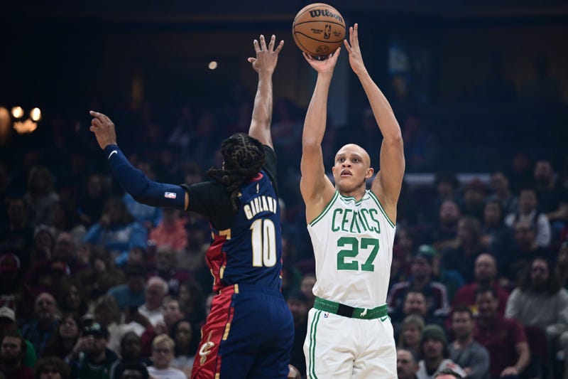 Boston Celtics guard Jordan Walsh (27) shoots a three point shot over Cleveland Cavaliers guard Darius Garland (10) during the first half at Rocket Arena.