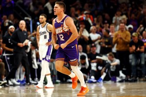 Oct 22, 2025; Phoenix, Arizona, USA; Phoenix Suns guard Collin Gillespie (12) reacts to a play during the second half against the Sacramento Kings at the Mortgage Matchup Center. Mandatory Credit: Mark J. Rebilas-Imagn Images