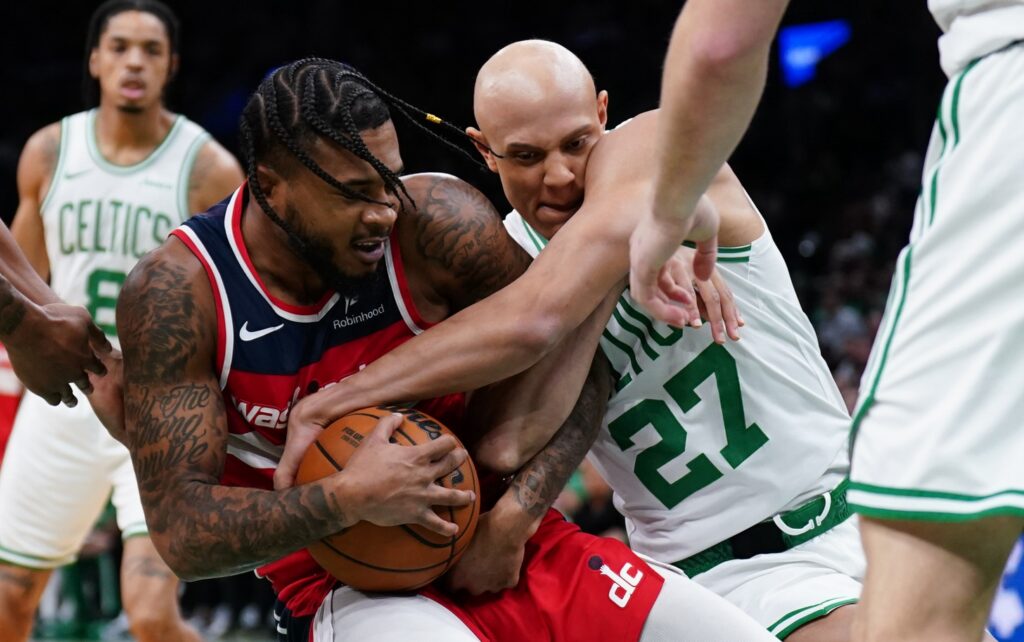 ; Washington Wizards forward Cam Whitmore (1) and Boston Celtics guard Jordan Walsh (27) work for the ball in the first quarter at TD Garden.