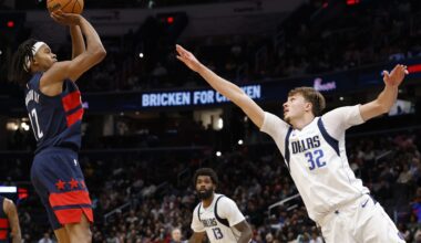 Nov 8, 2025; Washington, District of Columbia, USA; Washington Wizards guard Tre Johnson (12) shoots the ball over Dallas Mavericks forward Cooper Flagg (32) in the second half at Capital One Arena. Mandatory Credit: Geoff Burke-Imagn Images