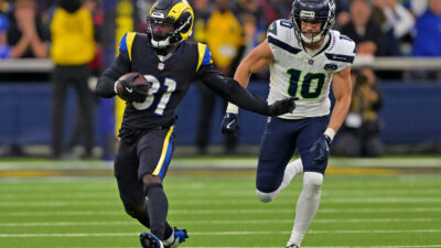 Nov 16, 2025; Inglewood, California, USA; Los Angeles Rams cornerback Darious Williams (31) runs the ball after an interception against Seattle Seahawks wide receiver Cooper Kupp (10) during the second half at SoFi Stadium.