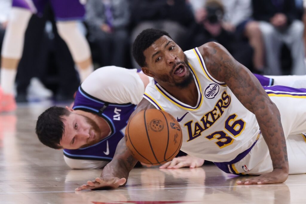 Nov 23, 2025; Salt Lake City, Utah, USA; Los Angeles Lakers guard Marcus Smart (36) and Utah Jazz center Jusuf Nurkic (30) goes for a loose ball during the second quarter at Delta Center. Mandatory Credit: Rob Gray-Imagn Images