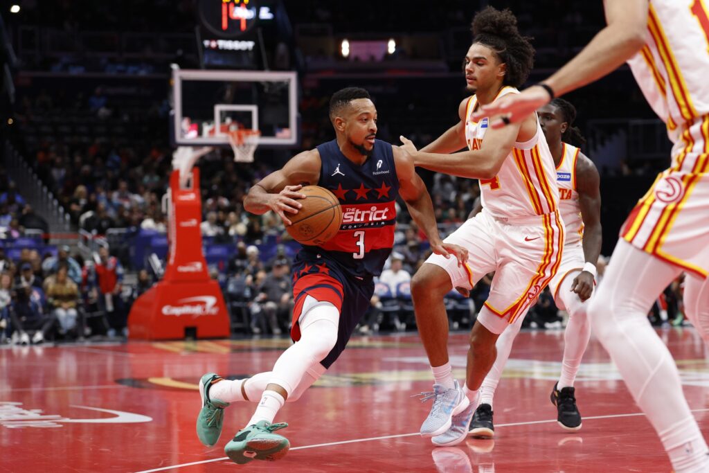 Washington Wizards guard CJ McCollum (3) drives to the basket as Atlanta Hawks forward Asa Newell (14) defends in the second half at Capital One Arena.