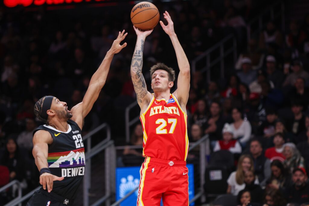 Atlanta Hawks guard Vit Krejci (27) shoots over Denver Nuggets forward Zeke Nnaji (22) in the second quarter at State Farm Arena.