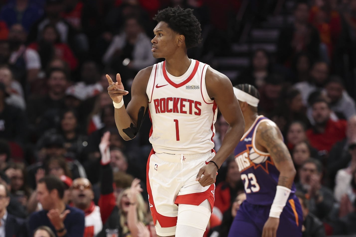 Houston Rockets guard Amen Thompson (1) reacts after scoring a basket during the fourth quarter against the Phoenix Suns at Toyota Center.