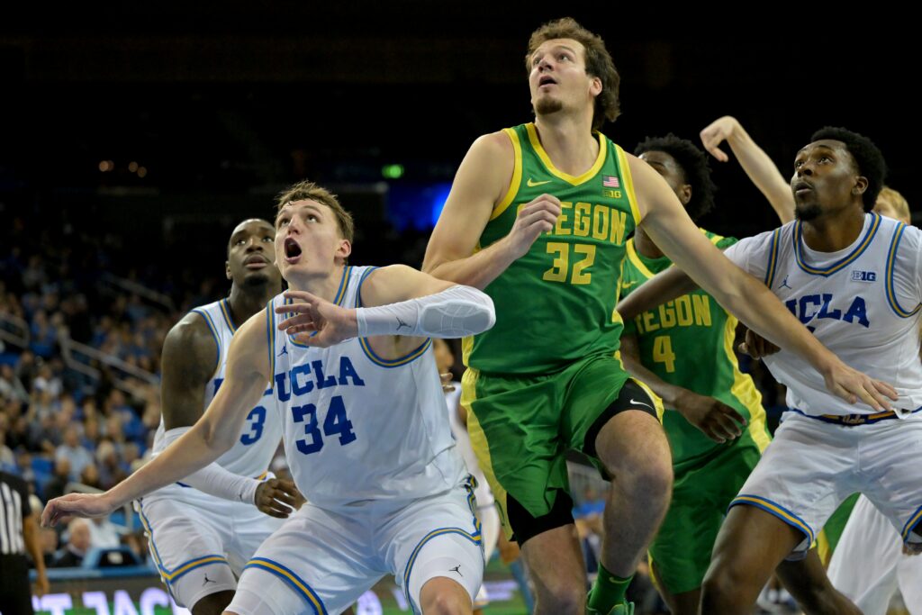 UCLA Bruins forward Tyler Bilodeau (34) boxes out Oregon Ducks center Nate Bittle (32) during the second half at Pauley Pavilion presented by Wescom Financial.