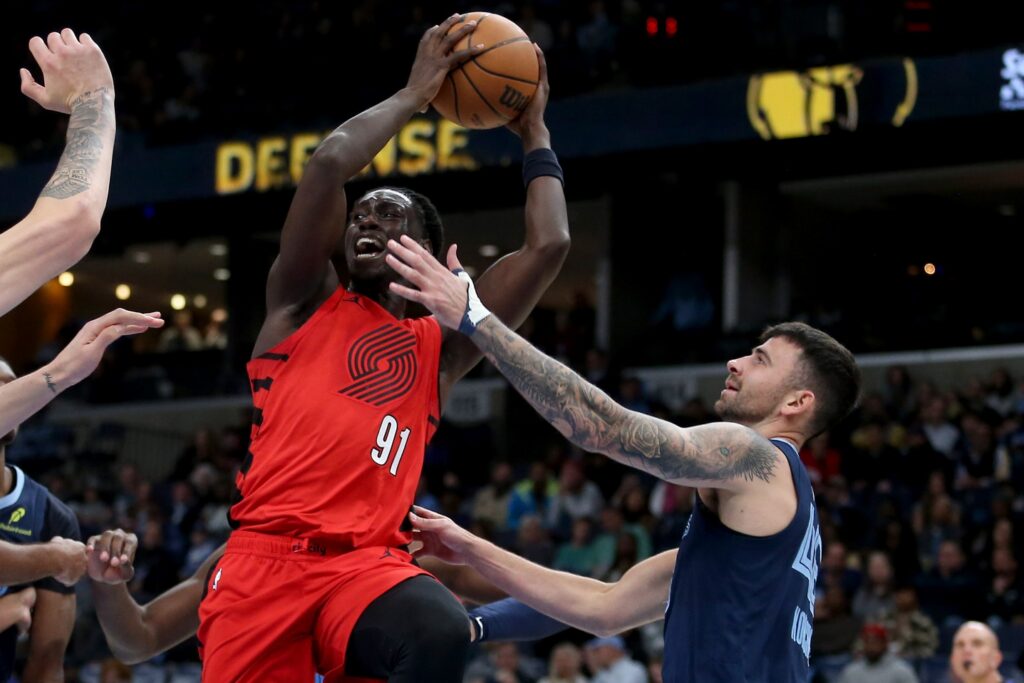  Portland Trail Blazers guard Sidy Cissoko (91) drives to the basket as Memphis Grizzlies John Konchar (46) defends during the second quarter at FedExForum.