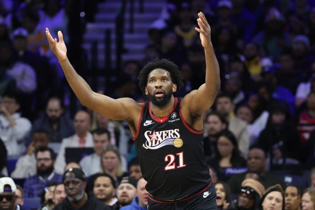 Dec 7, 2025; Philadelphia, Pennsylvania, USA; Philadelphia 76ers center Joel Embiid (21) reacts after scoring against the Los Angeles Lakers during the fourth quarter at Xfinity Mobile Arena.