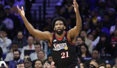 Dec 7, 2025; Philadelphia, Pennsylvania, USA; Philadelphia 76ers center Joel Embiid (21) reacts after scoring against the Los Angeles Lakers during the fourth quarter at Xfinity Mobile Arena.