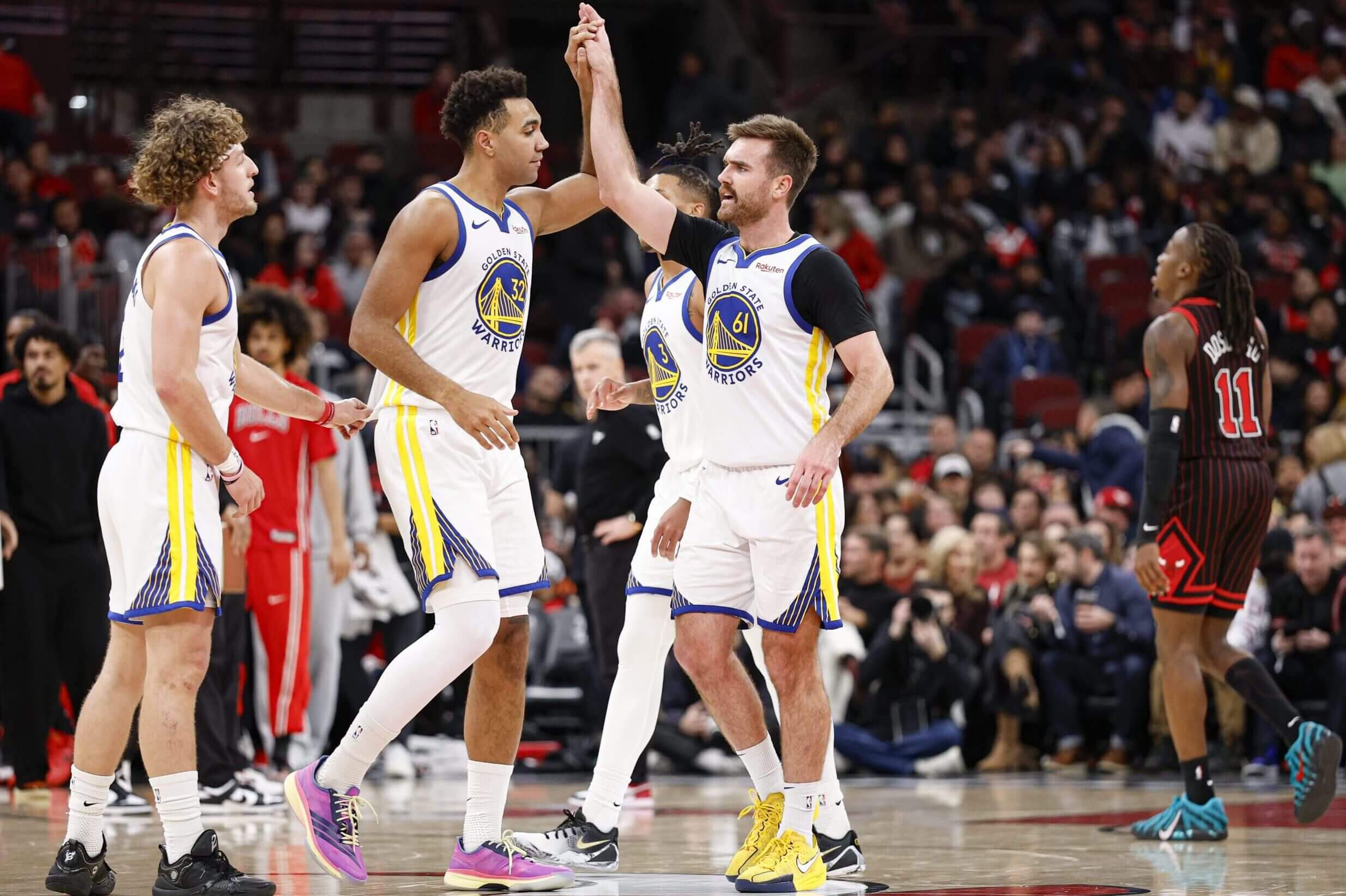 Pat Spencer celebrates with Warriors teammates.