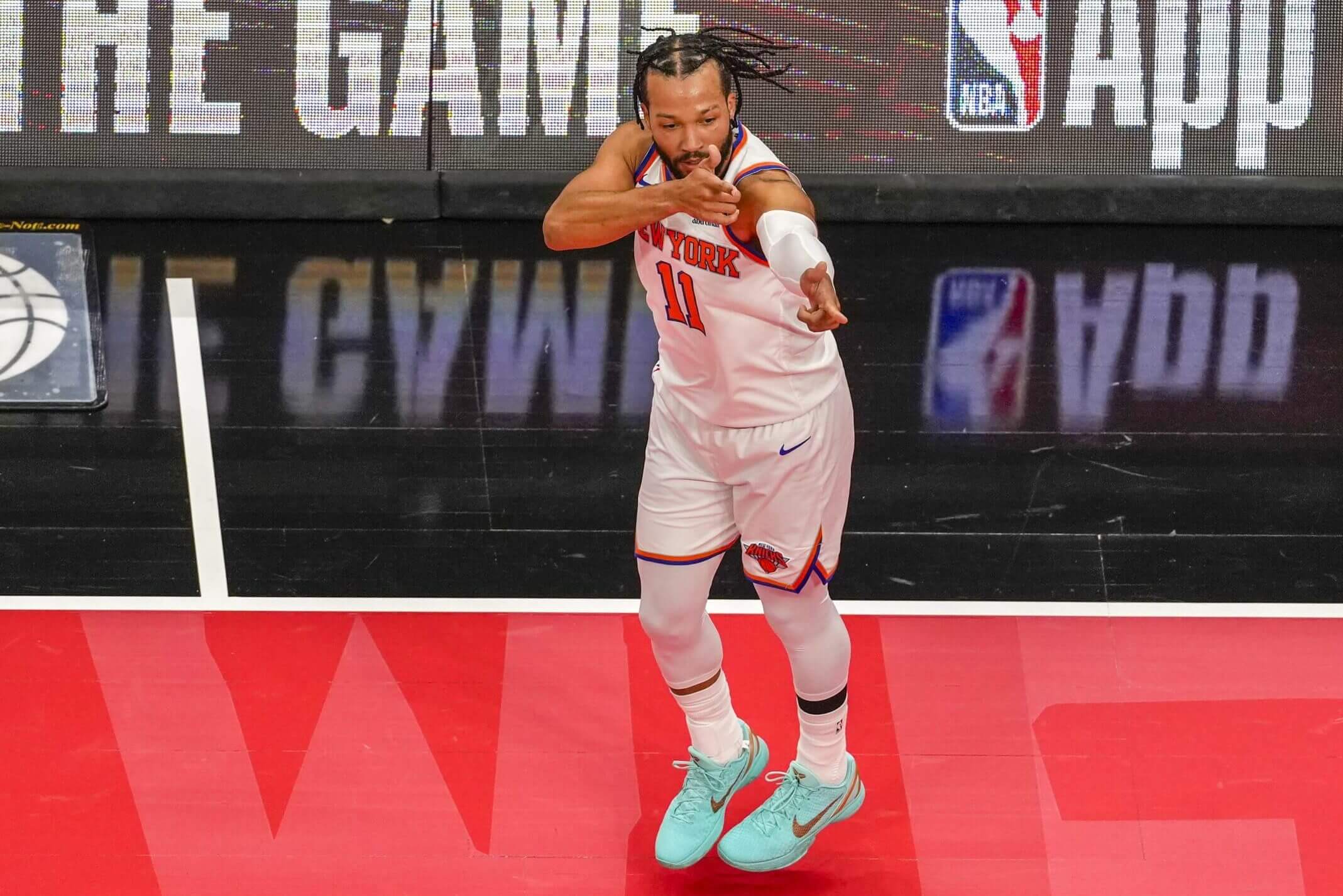 Jalen Brunson gestures during an NBA Cup game.