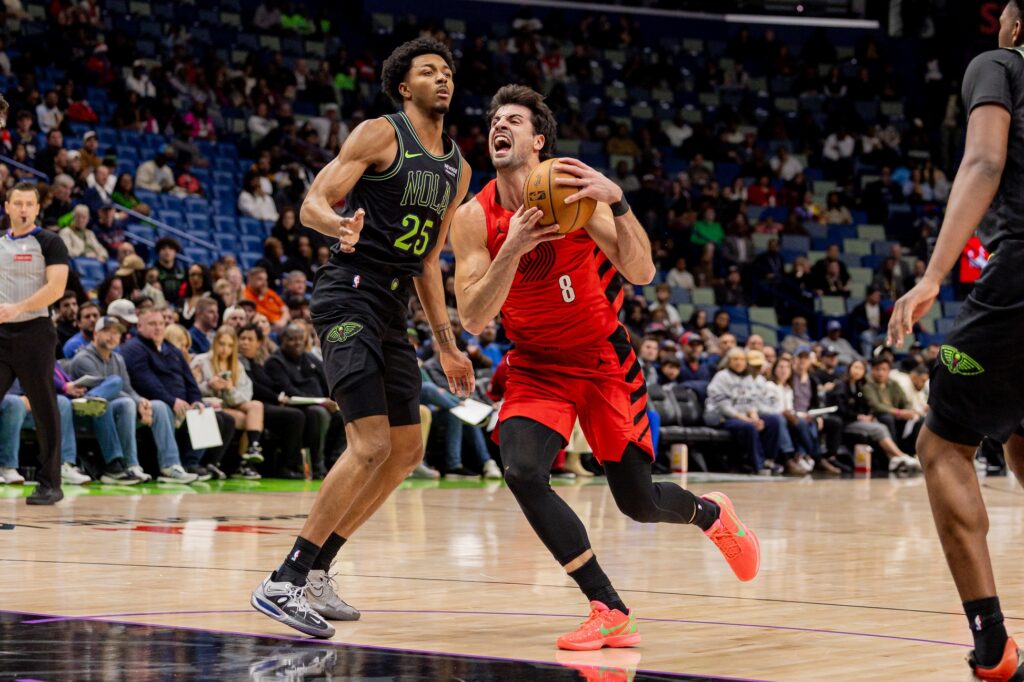 Portland Trail Blazers forward Deni Avdija (8) dribbles against New Orleans Pelicans forward Trey Murphy III (25) during the first half at Smoothie King Center.