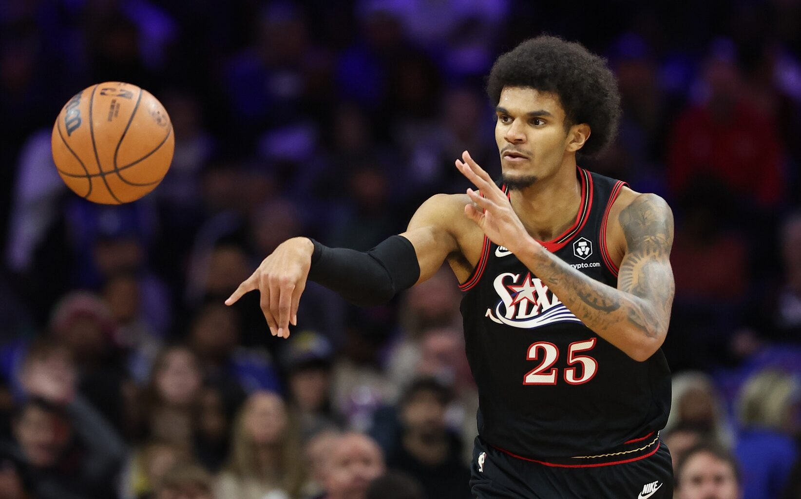 Dec 12, 2025; Philadelphia, Pennsylvania, USA; Philadelphia 76ers forward Dominick Barlow (25) passes the ball against the Indiana Pacers during the first quarter at Xfinity Mobile Arena.