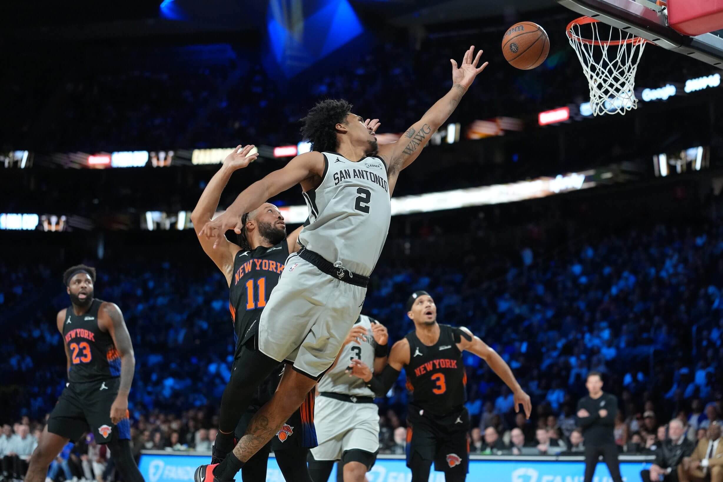 San Antonio's Dylan Harper goes up vs. the Knicks.