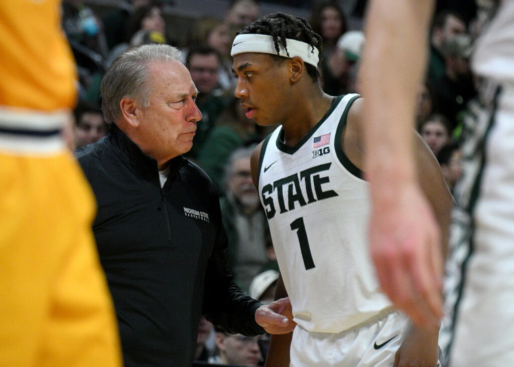 Michigan State Spartans head coach Tom Izzo pulls Michigan State Spartans guard Jeremy Fears Jr. aside for a moment