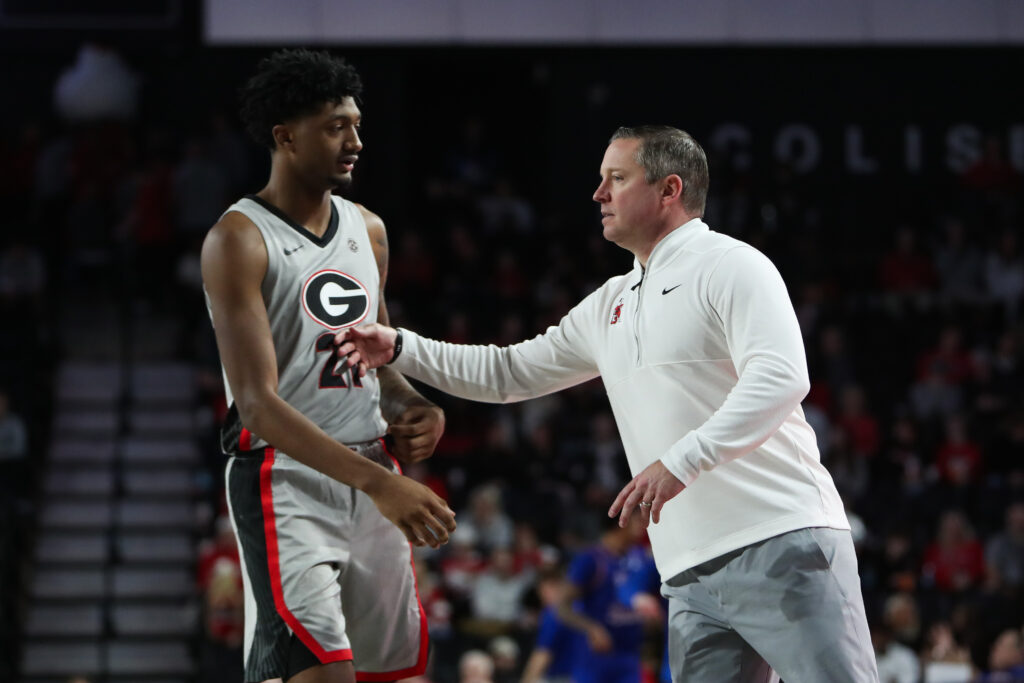 Georgia Bulldogs head coach Mike White talks to Georgia Bulldogs forward Jake Wilkins