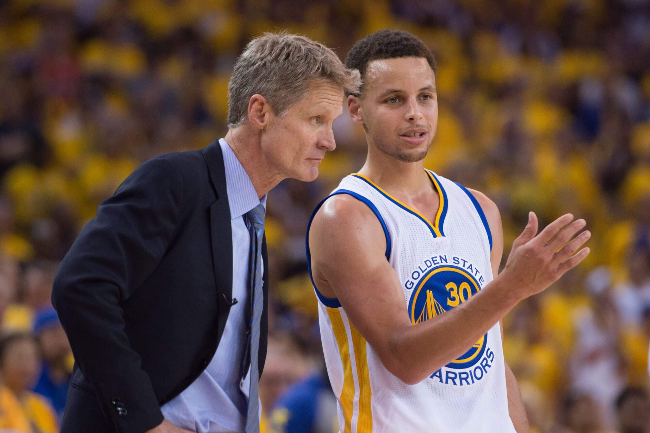 Steve Kerr and Stephen Curry during a game in 2015.