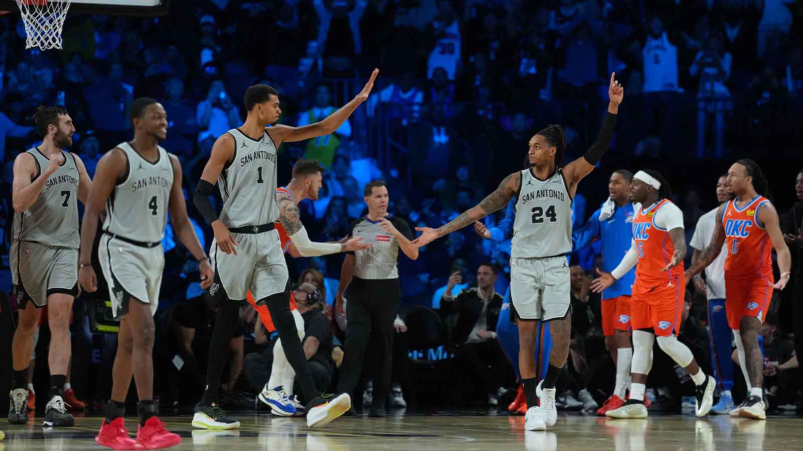 San Antonio Spurs forward Victor Wembanyama (1) and guard Devin Vassell (24) react as the final buzzer sounds during a game against the Oklahoma City Thunder at T-Mobile Arena.