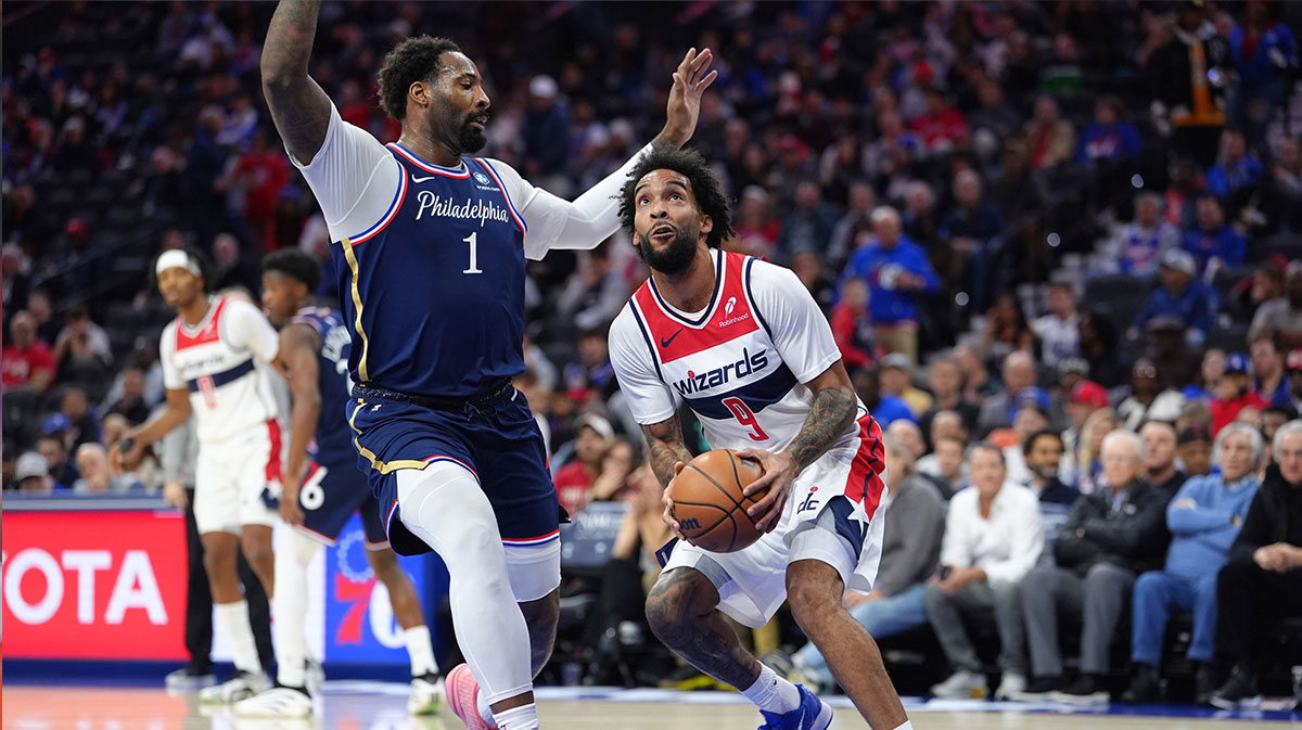 Washington Wizards forward Justin Champagnie (9) drives to shoot against Philadelphia 76ers center Andre Dummond (1) in the first quarter at Xfinity Mobile Arena.