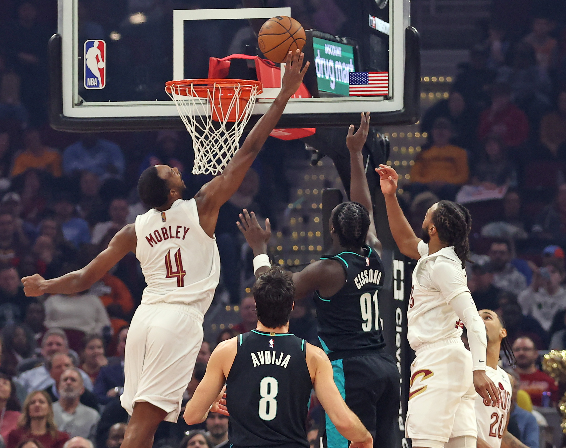 Cleveland Cavaliers center Evan Mobley tries to block a shot by Portland Trail Blazers guard Sidy Cissoko in the first half of play. 