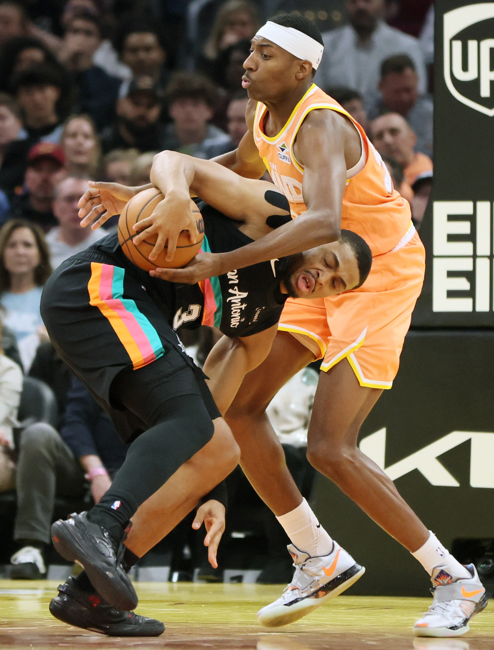 Cleveland Cavaliers forward Nah’Qwan Tomlin fouls San Antonio Spurs forward Keldon Johnson on his drive to the basket in the first half at Rocket Arena. 