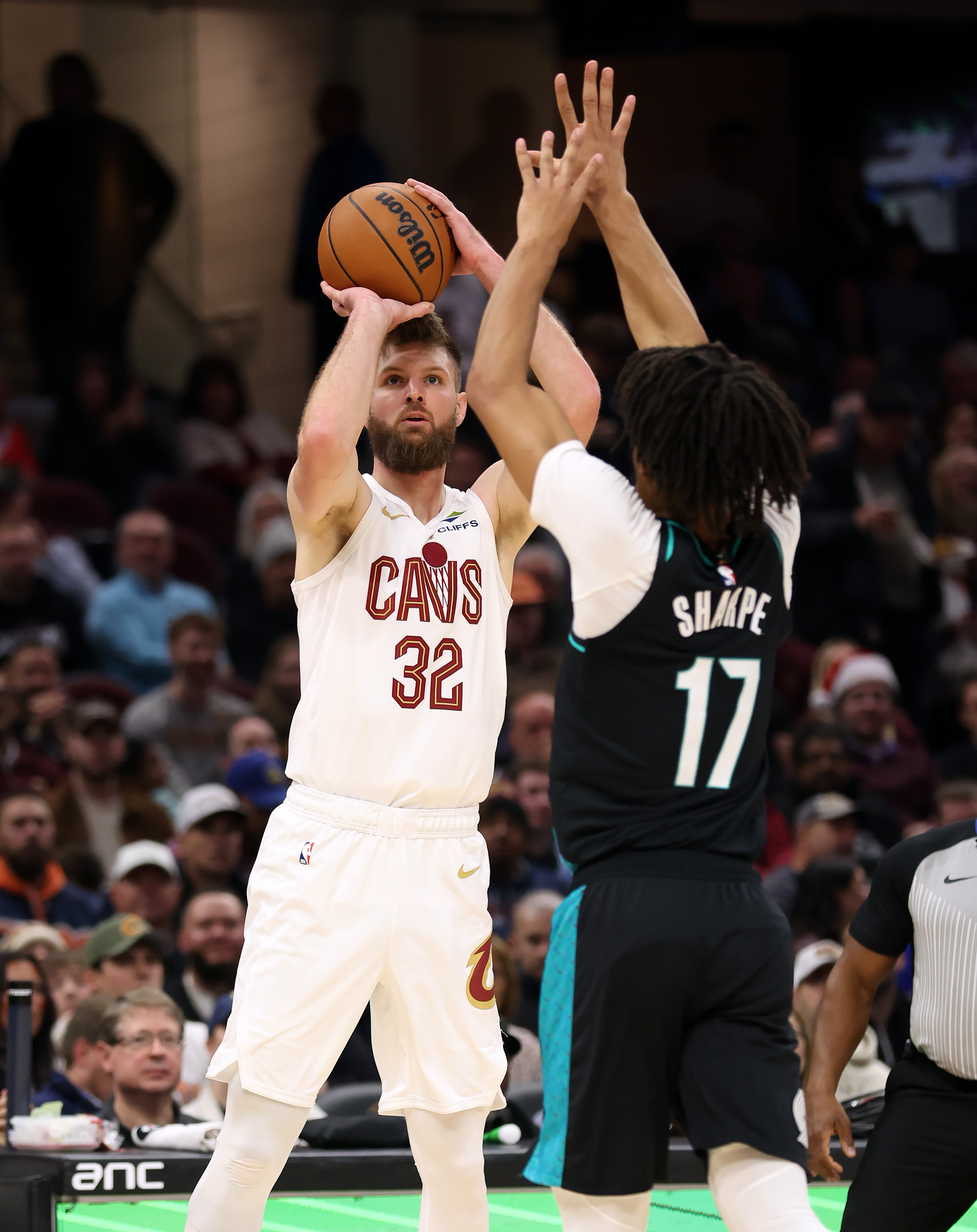 Cleveland Cavaliers forward Dean Wade shoots over Portland Trail Blazers guard Shaedon Sharpe in the first half of play. 