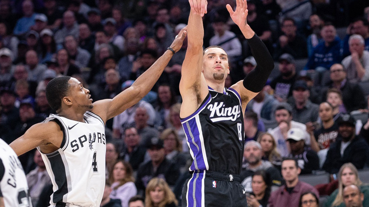 Sacramento Kings guard Zach LaVine (8) takes a three point shot over San Antonio Spurs guard De'Aaron Fox (4) during the second quarter at Golden 1 Center.