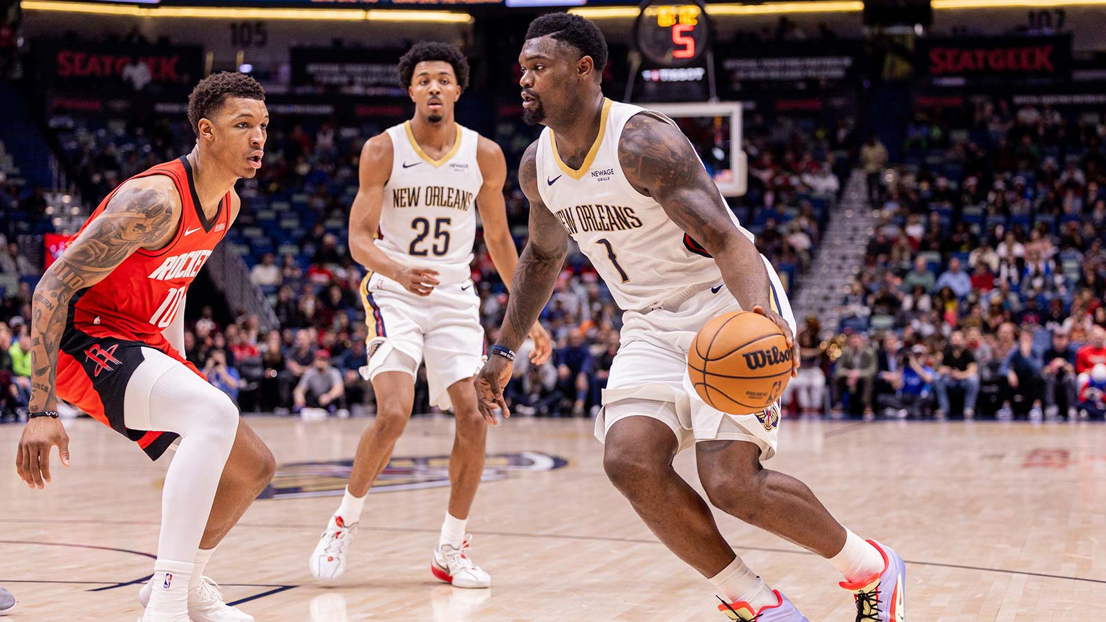 Dec 18, 2025; New Orleans, Louisiana, USA; New Orleans Pelicans forward Zion Williamson (1) dribbles against Houston Rockets forward Jabari Smith Jr. (10) during the first half at Smoothie King Center. Mandatory Credit: Stephen Lew-Imagn Images