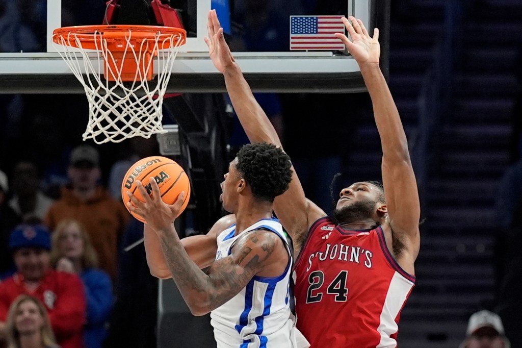  Otega Oweh looks to put up a shot as Zuby Ejiofor defends during St. John's 78-66 loss to Kentucky on Dec. 20, 2025 in Atlanta.