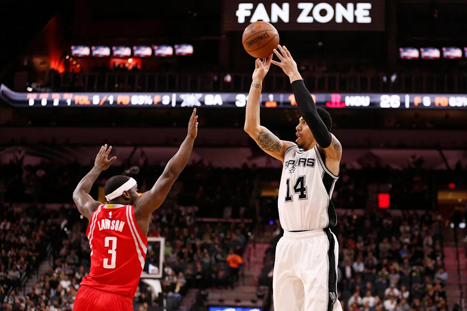 Jan 27, 2016; San Antonio, TX, USA; San Antonio Spurs shooting guard Danny Green (14) shoots the ball over Houston Rockets point guard Ty Lawson (3) during the first half at AT&T Center. Mandatory Credit: Soobum Im-USA TODAY Sports