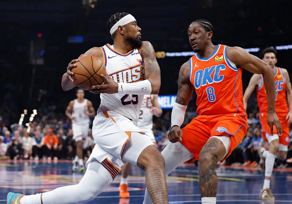 Dec 10, 2025; Oklahoma City, Oklahoma, USA; Phoenix Suns guard Jordan Goodwin (23) drives to the basket against Oklahoma City Thunder guard Jalen Williams (8) during the second quarter at Paycom Center. Mandatory Credit: Alonzo Adams-Imagn Images