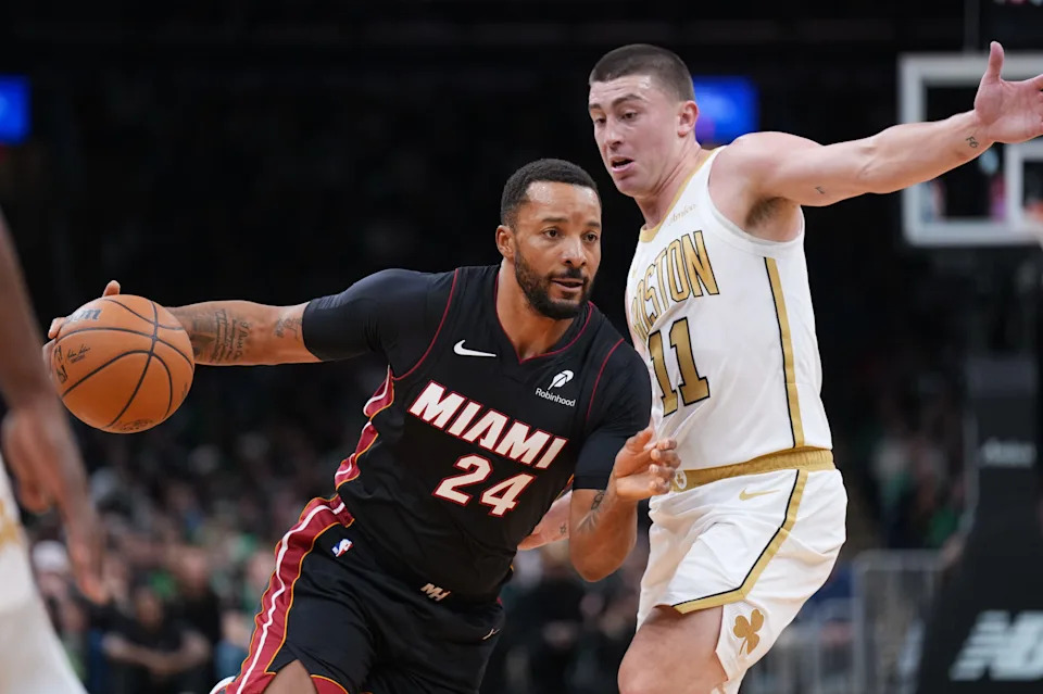Dec 19, 2025; Boston, Massachusetts, USA; Miami Heat guard Norman Powell (24) drives the ball against Boston Celtics guard Payton Pritchard (11) in the first quarter at TD Garden. Mandatory Credit: David Butler II-Imagn Images