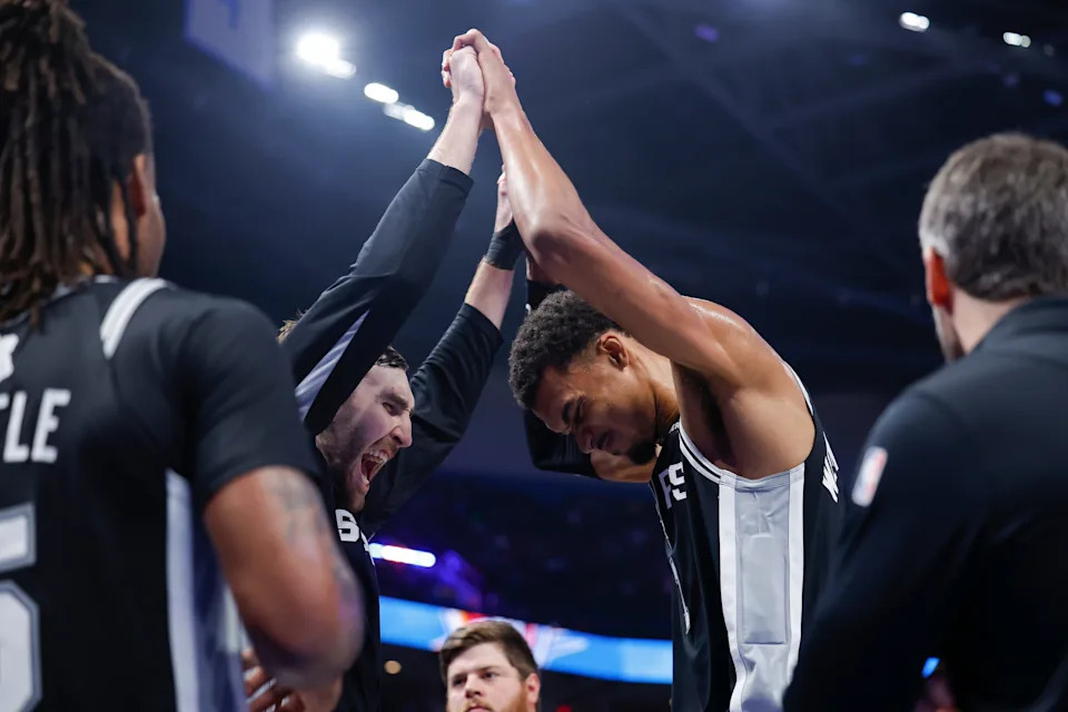 Dec 25, 2025; Oklahoma City, Oklahoma, USA; San Antonio Spurs forward Victor Wembanyama (1) and center Luke Kornet (7) celebrate at the end of the fourth quarter against the Oklahoma City Thunder at Paycom Center. Mandatory Credit: Alonzo Adams-Imagn Images