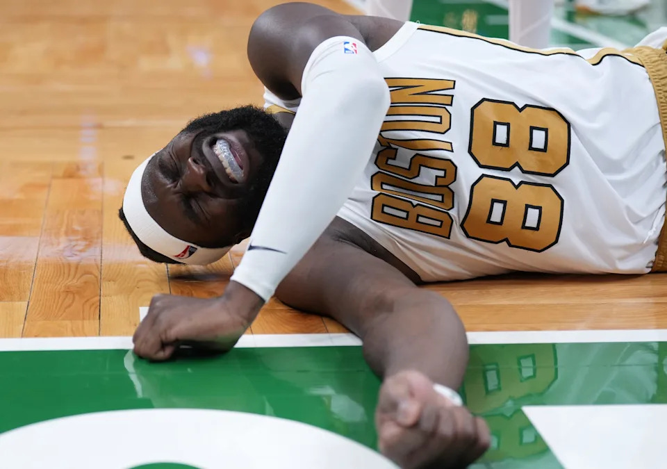 Dec 19, 2025; Boston, Massachusetts, USA; Boston Celtics center Neemias Queta (88) reacts after a fall against the Miami Heat in the second half at TD Garden. Mandatory Credit: David Butler II-Imagn Images