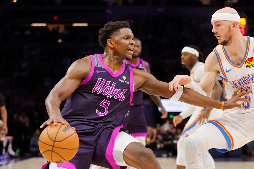 Dec 19, 2025; Minneapolis, Minnesota, USA; Minnesota Timberwolves guard Anthony Edwards (5) works around Oklahoma City Thunder guard Alex Caruso (9) in the third quarter at Target Center. Mandatory Credit: Bruce Kluckhohn-Imagn Images
