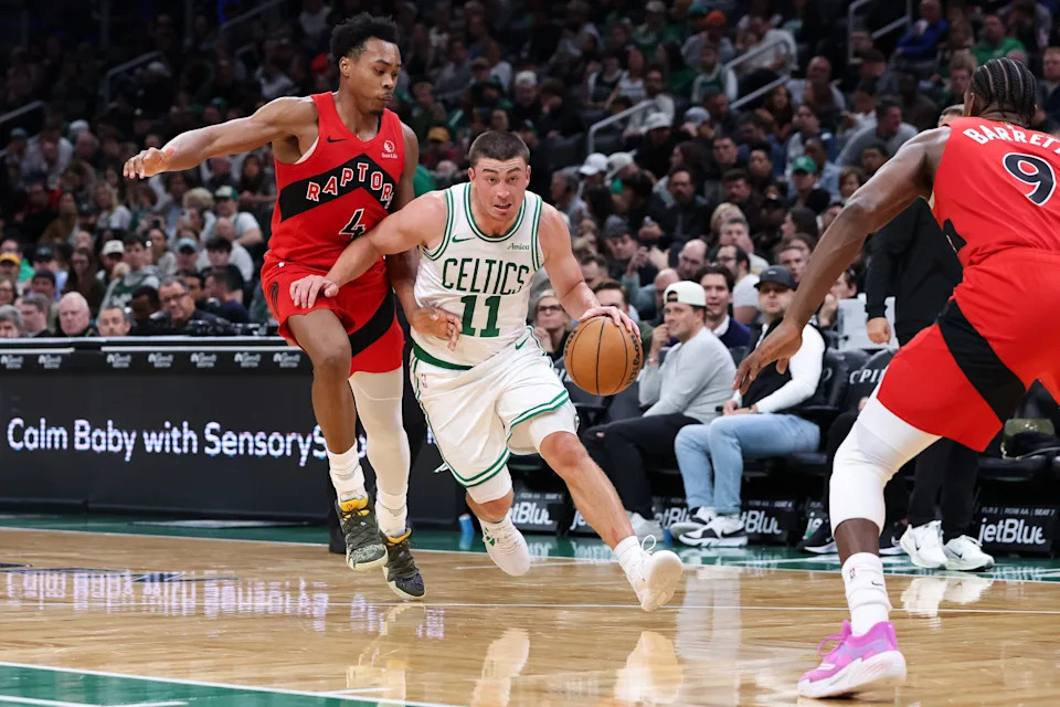 Oct 15, 2025; Boston, Massachusetts, USA; Boston Celtics guard Payton Pritchard (11) drives to the basket during the first half against the Toronto Raptors at TD Garden. Mandatory Credit: Paul Rutherford-Imagn Images