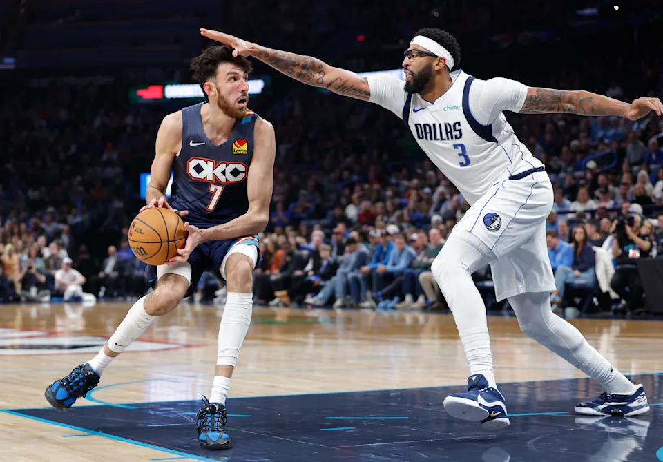 Dec 5, 2025; Oklahoma City, Oklahoma, USA; Oklahoma City Thunder center Chet Holmgren (7) drives to the basket as Dallas Mavericks forward Anthony Davis (3) defends during the second half at Paycom Center. Mandatory Credit: Alonzo Adams-Imagn Images