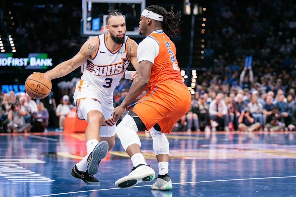 OKLAHOMA CITY, OKLAHOMA - DECEMBER 10: Dillon Brooks #3 of the Phoenix Suns drives against Luguentz Dort #5 of the Oklahoma City Thunder during the second half of the Emirates NBA Cup - Quarterfinals game at Paycom Center on December 10, 2025 in Oklahoma City, Oklahoma. NOTE TO USER: User expressly acknowledges and agrees that, by downloading and or using this photograph, User is consenting to the terms and conditions of the Getty Images License Agreement. (Photo by William Purnell/Getty Images)