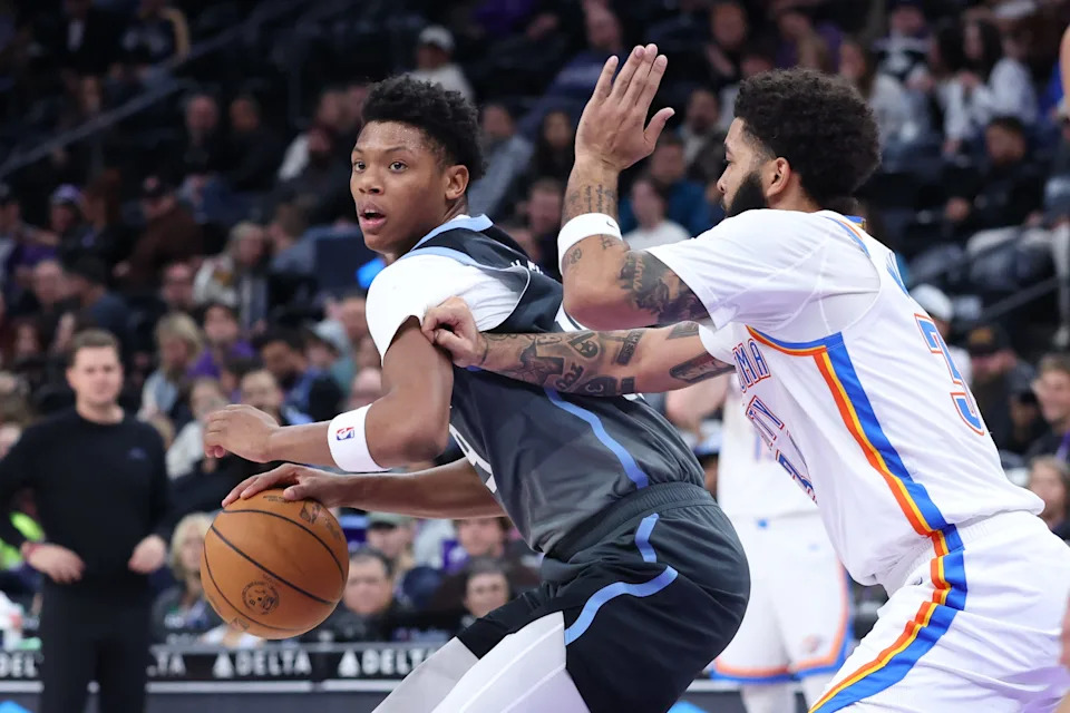 Dec 7, 2025; Salt Lake City, Utah, USA; Utah Jazz guard Ace Bailey (19) looks for the play as Oklahoma City Thunder guard Kenrich Williams (34) defends during the second half at Delta Center. Mandatory Credit: Rob Gray-Imagn Images