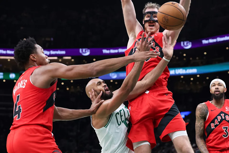 Oct 15, 2025; Boston, Massachusetts, USA; Toronto Raptors guard Scottie Barnes (4) defends Boston Celtics guard Derrick White (9) at TD Garden. Mandatory Credit: Paul Rutherford-Imagn Images