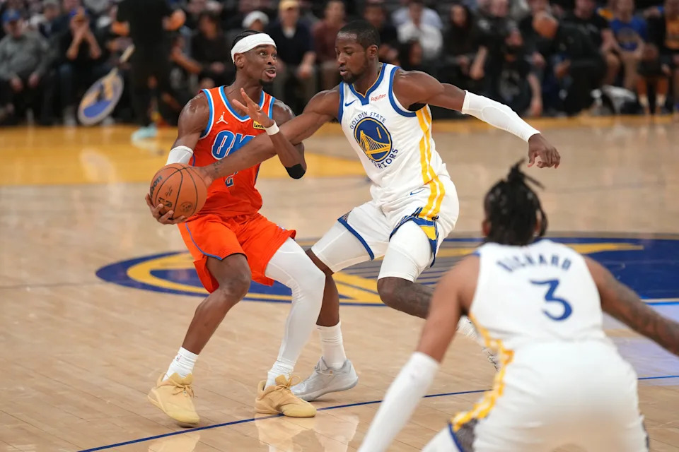 Dec 2, 2025; San Francisco, California, USA; Oklahoma City Thunder guard Shai Gilgeous-Alexander (2) is fouled by Golden State Warriors forward Jonathan Kuminga (1) in the third quarter at the Chase Center. Mandatory Credit: Cary Edmondson-Imagn Images
