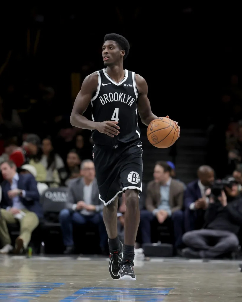 Brooklyn Nets guard Drake Powell (4) brings the ball up court against the Charlotte Hornets during the third quarter at Barclays Center. Brad Penner-Imagn Images