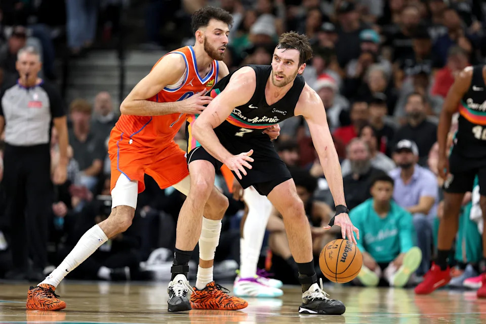 SAN ANTONIO, TEXAS - DECEMBER 23: Chet Holmgren #7 of the Oklahoma City Thunder defends Luke Kornet #7 of the San Antonio Spurs during the second quarter of the game at Frost Bank Center on December 23, 2025 in San Antonio, Texas. (Photo by Kenneth Richmond/Getty Images)