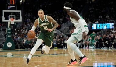 Milwaukee Bucks' Kyle Kuzma (18) drives to the basket against Boston Celtics' Neemias Queta during the first half of an NBA basketball game Thursday, Dec. 11, 2025, in Milwaukee.