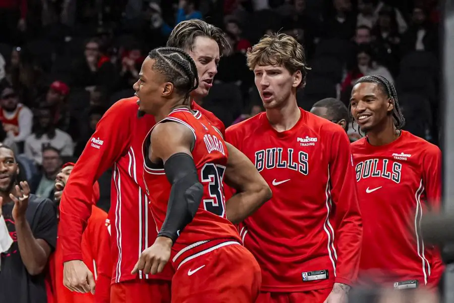 Dec 21, 2025; Atlanta, Georgia, USA; Chicago Bulls forward Isaac Okoro (35) reacts with forward Zach Collins (12) after scoring a basket against the Atlanta Hawks during the second half at State Farm Arena. Mandatory Credit: Dale Zanine-Imagn Images