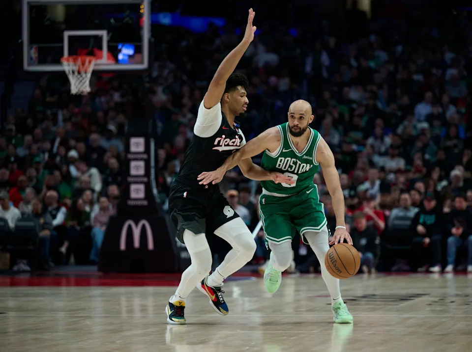 Mar 23, 2025; Portland, Oregon, USA; Boston Celtics guard Derrick White (9) dribbles the ball during the second half against Portland Trail Blazers guard Shaedon Sharpe (17) at Moda Center. Mandatory Credit: Troy Wayrynen-Imagn Images