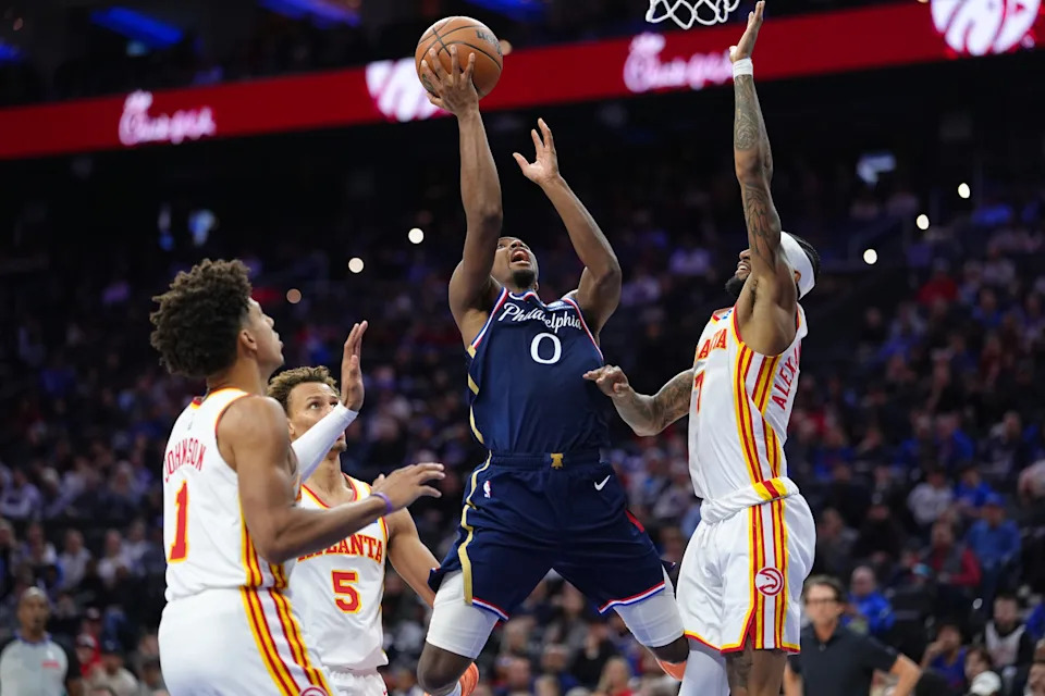Nov 30, 2025; Philadelphia, Pennsylvania, USA; Philadelphia 76ers guard Tyrese Maxey (0) drives to shoot against Atlanta Hawks guard Nickeil Alexander-Walker (7) in the third quarter at Xfinity Mobile Arena. Mandatory Credit: Kyle Ross-Imagn Images